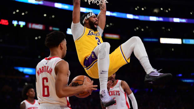 Nov 2, 2021; Los Angeles, California, USA; Los Angeles Lakers forward Anthony Davis (3) dunks for a basket in front of Houston Rockets forward Kenyon Martin Jr. (6) during the second half at Staples Center. Mandatory Credit: Gary A. Vasquez-USA TODAY Sports